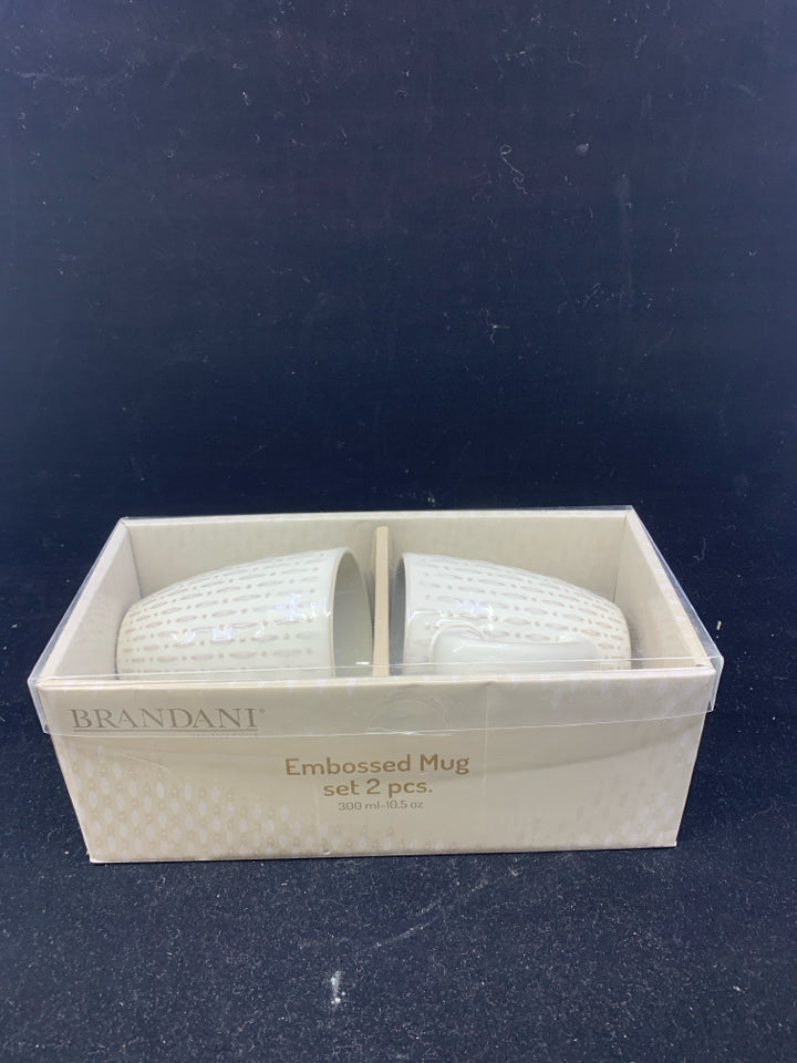 NIB 2 BRANDANI CREAM EMBOSSED MUGS.