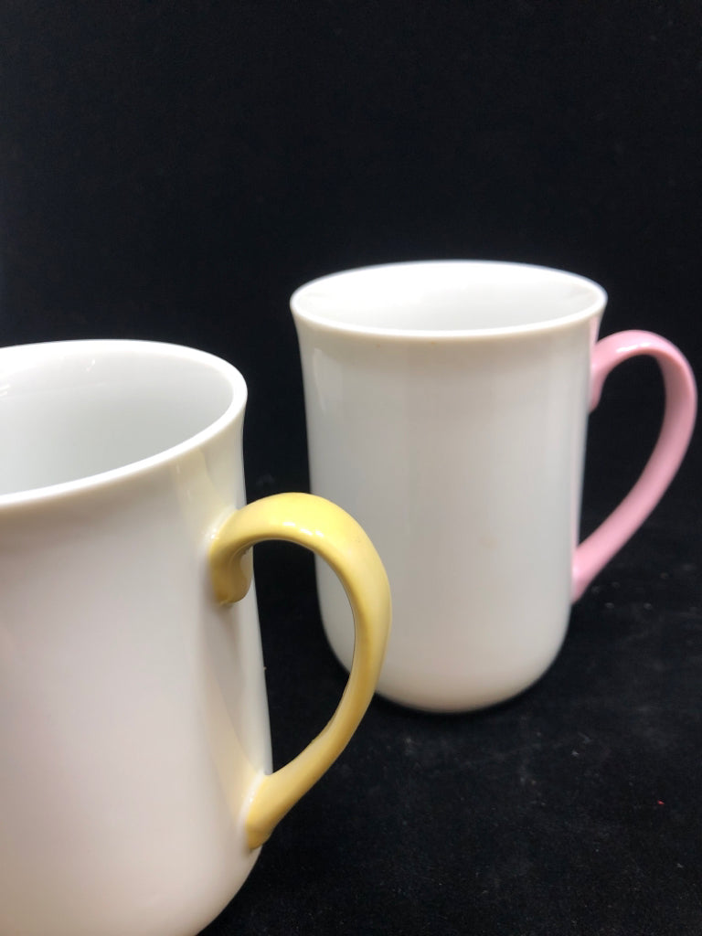 4 WHITE MUGS W/MULTI COLORED HANDLES.