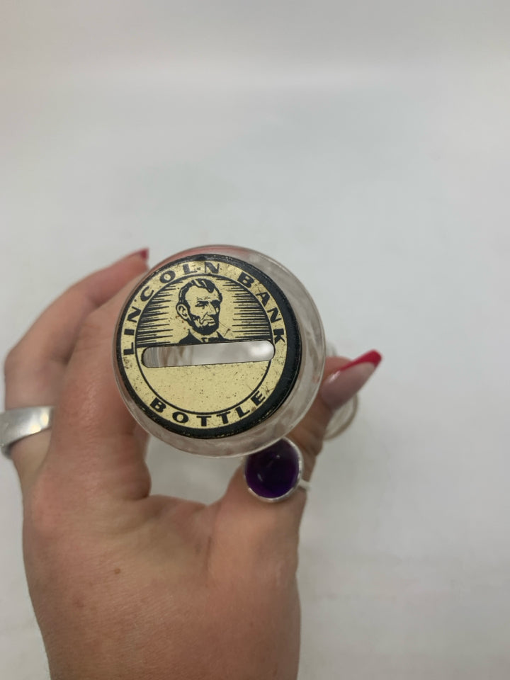 VTG ABRAHAM LINCOLN GLASS BOTTLE BANK.