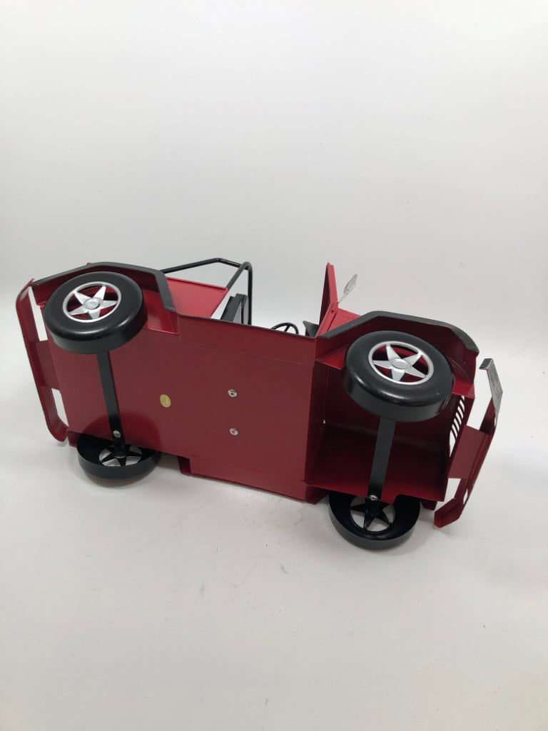 RED METAL JEEP W/CHRISTMAS TREE.