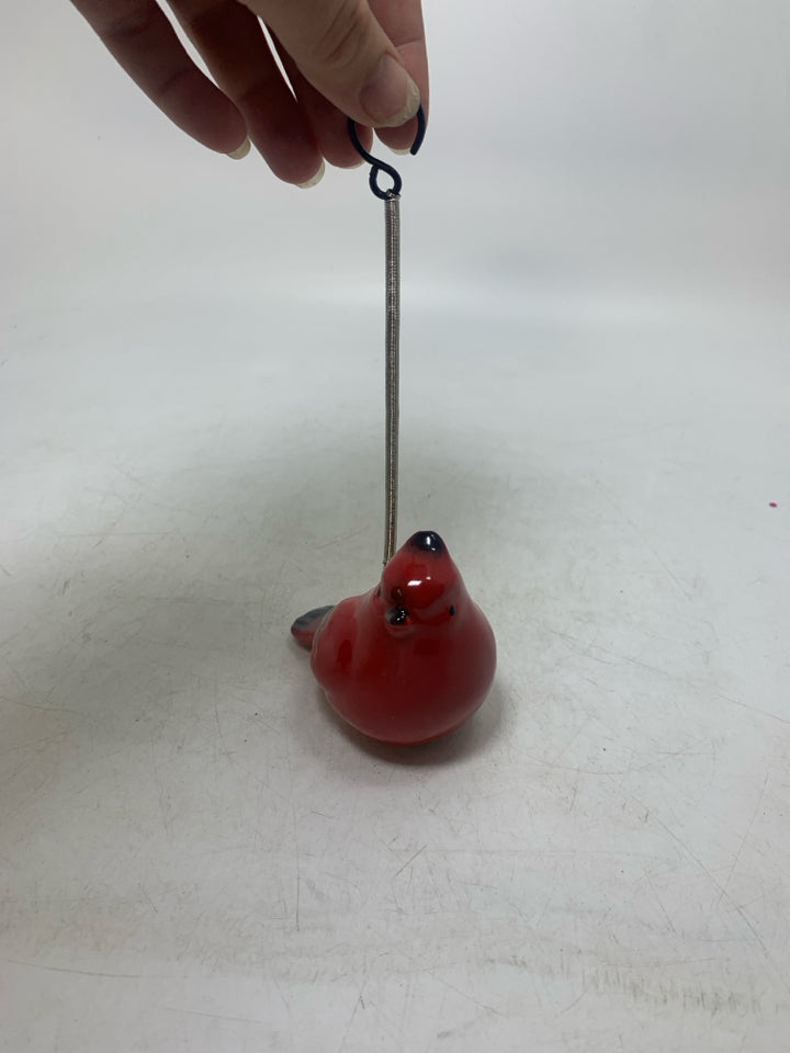RED CERAMIC CARDINAL ON BUNGLE STRING.