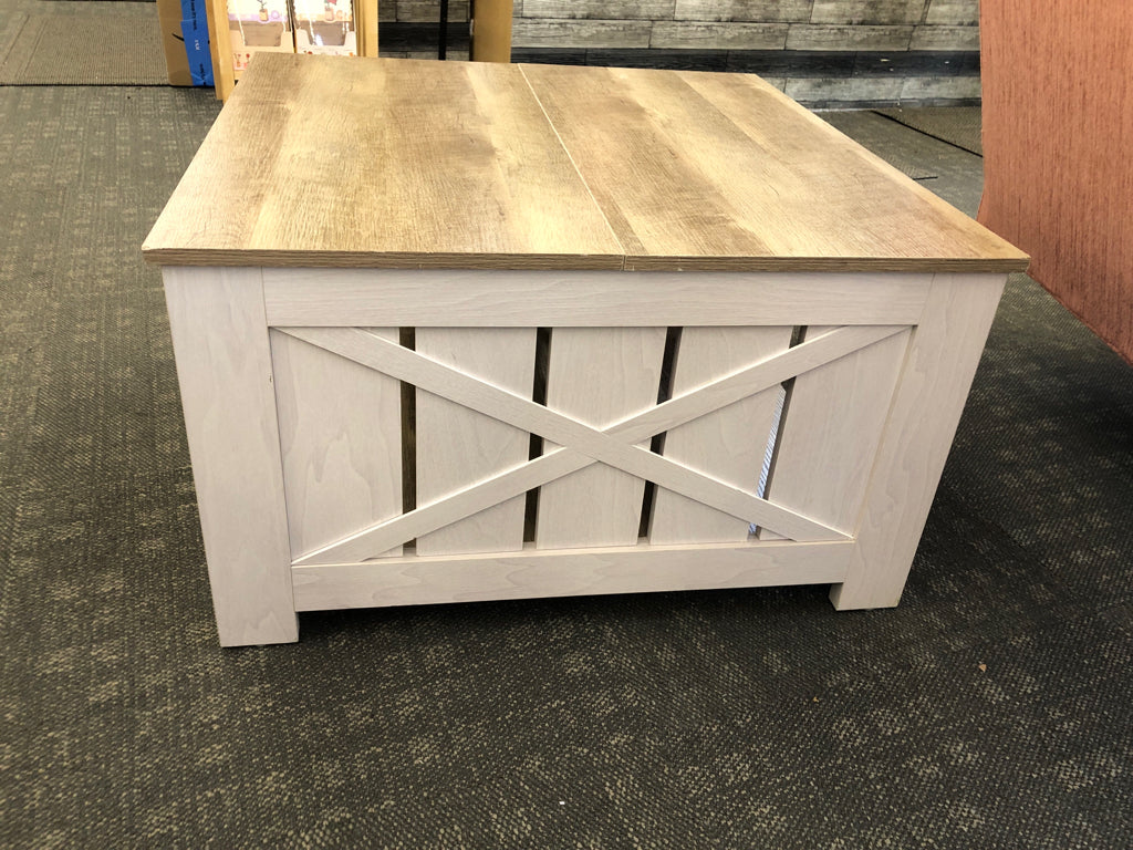 GRAY COFFEE TABLE W/CROSSED DESIGN & WOOD TOP.