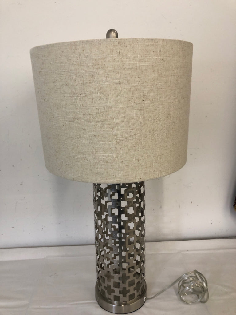 SILVER CUTOUT CYLINDER BASE LAMP W/ CREAM SHADE 3 WAY.