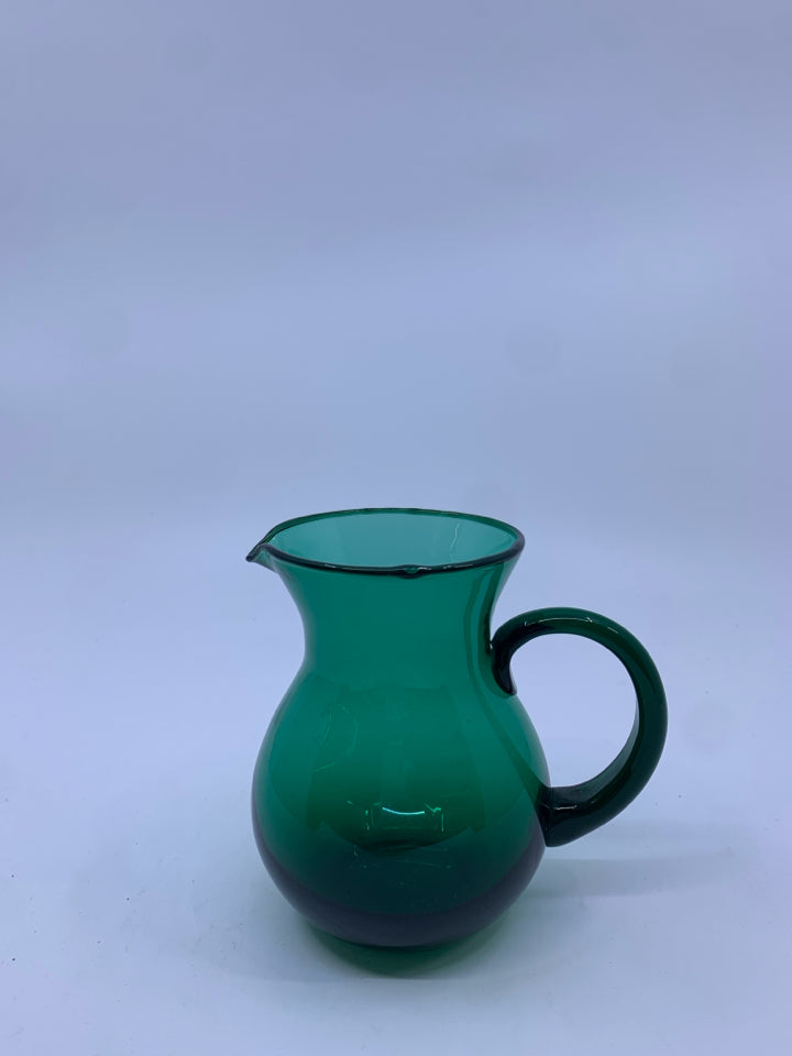 SMALL LIGHT GREEN GLASS PITCHER.