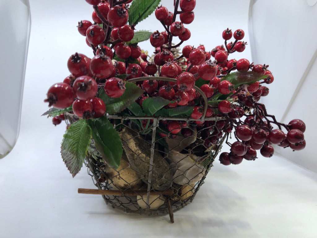 BASKET FULL OF FAUX HOLIDAY ARRANGEMENT.