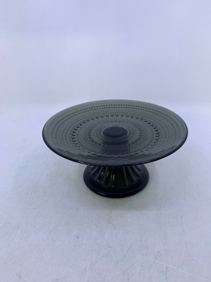 BLACK GLASS FOOTED CAKE STAND W/ EMBOSSED BEADING.