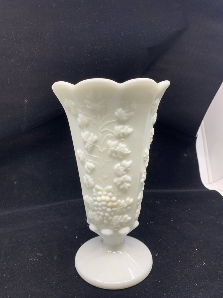 VTG GRAPE PATTERN EMBOSSED FOOTED MILK GLASS VASE.