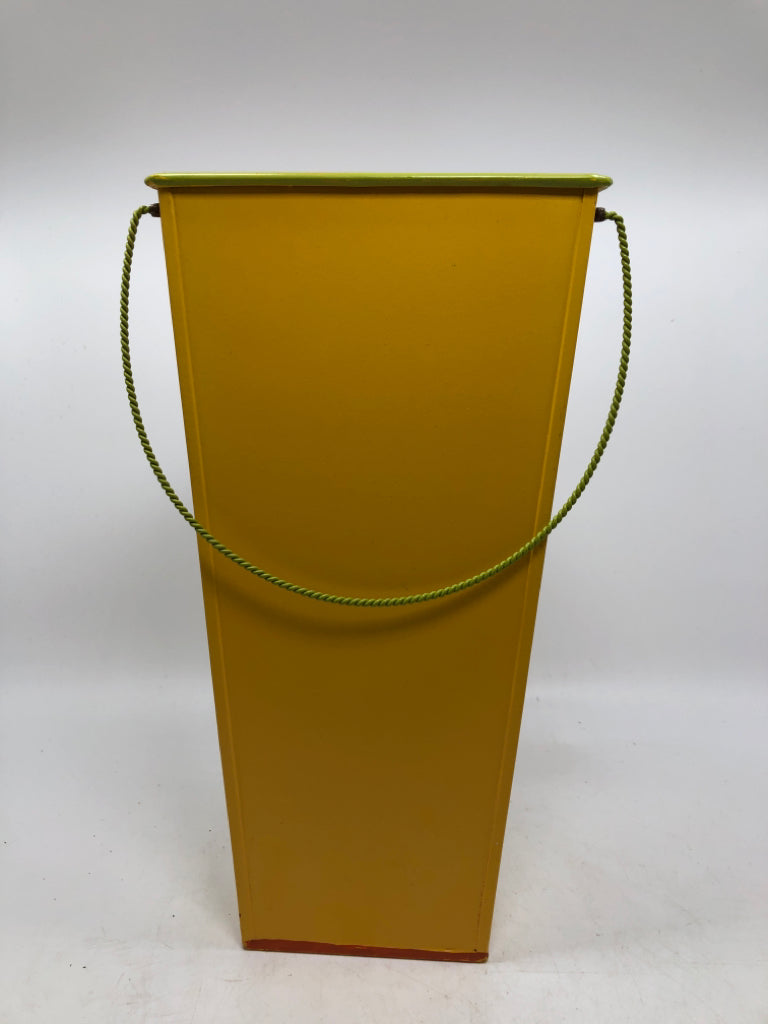 YELLOW METAL WALL POCKET W/FLOWERS.