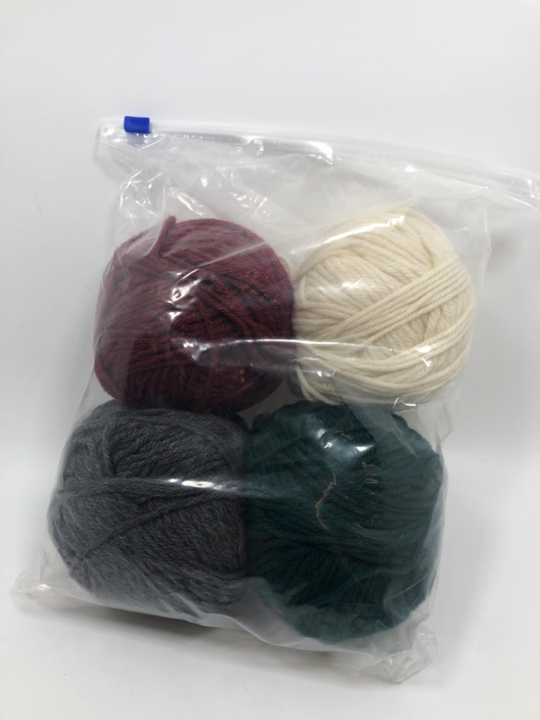 4 RED/GREEN/GREY/WHITE YARN IN BAG.