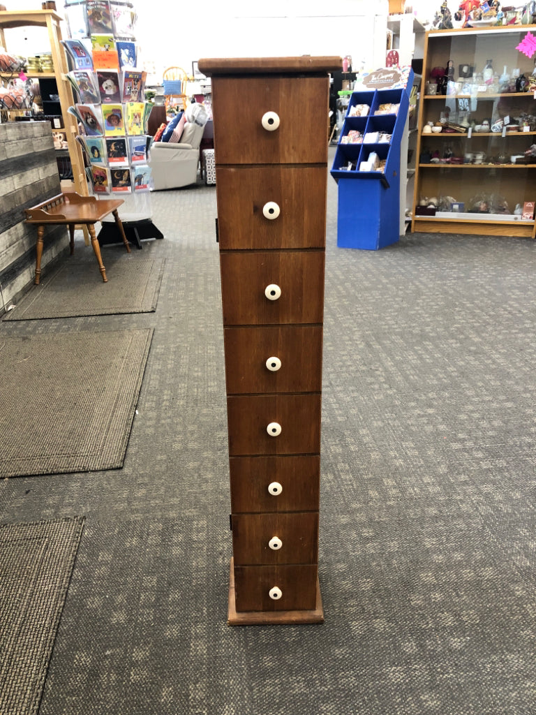 NARROW LIGHT-WOOD CABINET.