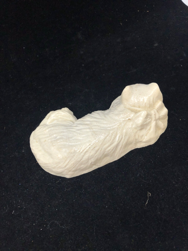 WHITE HEAVY CAT LAYING DOWN FIGURE.