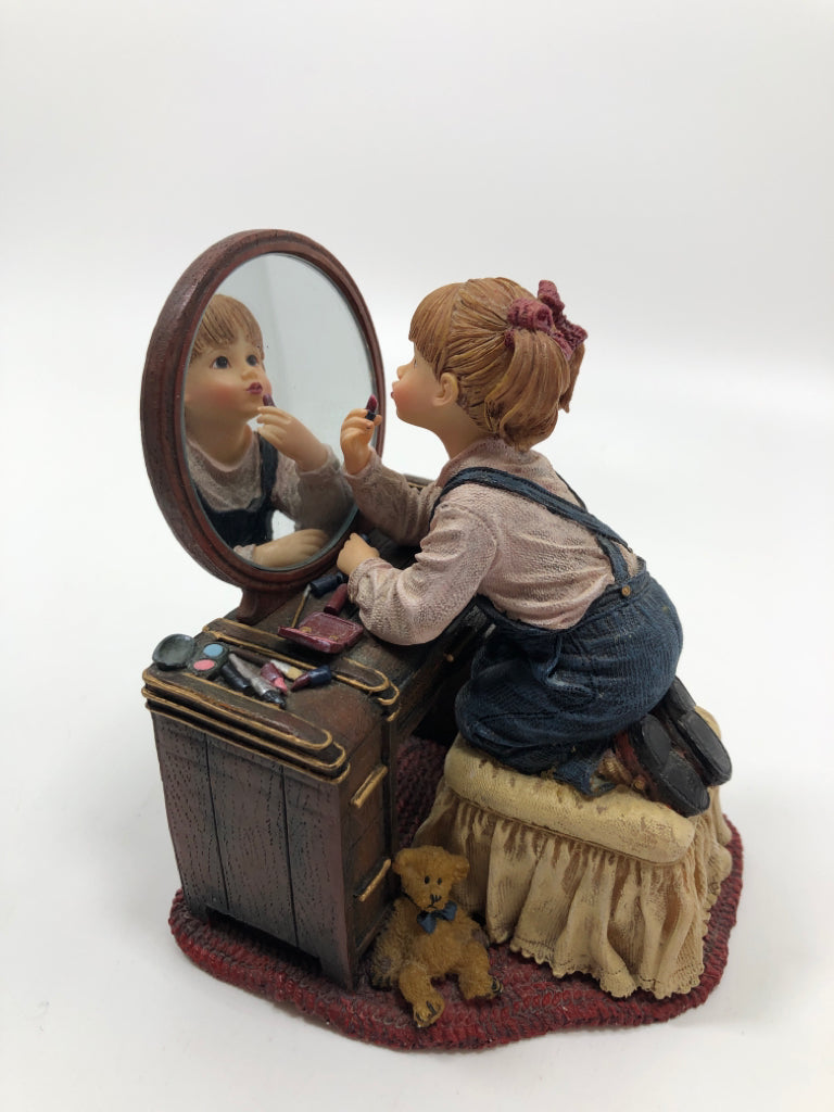 RESIN GIRL FIGURINE APPLYING MAKEUP.