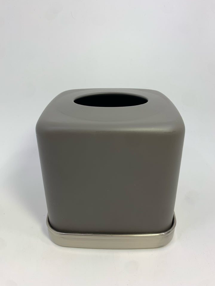 GREY TISSUE BOX COVER W/SILVER RIM ON BOTTOM.