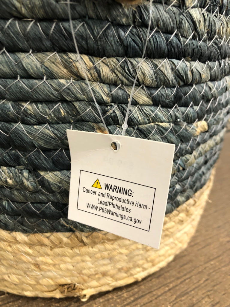 GRAY/BEIGE WOVEN BASKET W/FAUX LEATHER HANDLES.