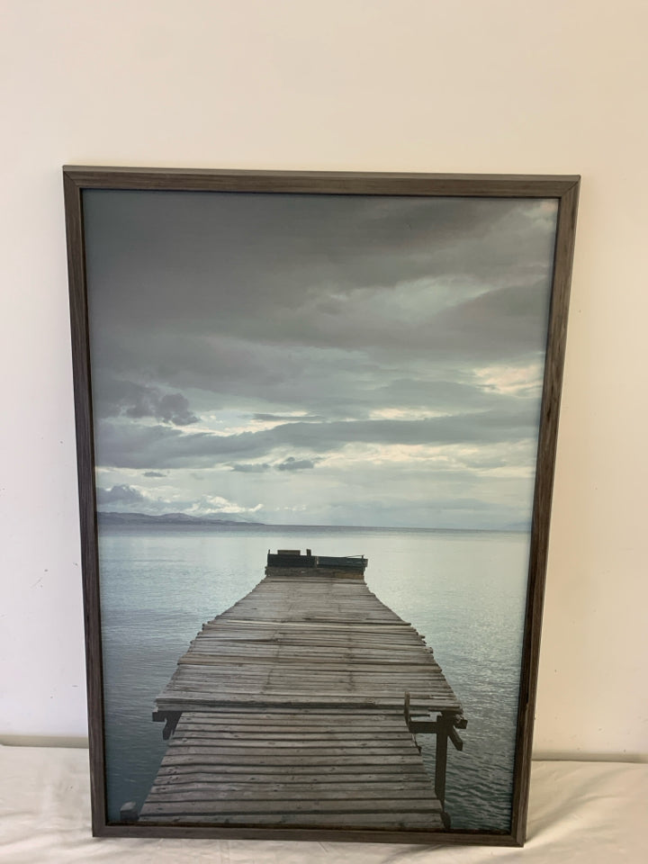 OLD DOCK PIER PRINT IN A GREY FRAME.