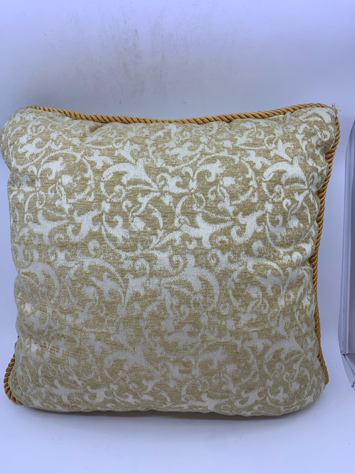 TAN SCROLL PILLOW.