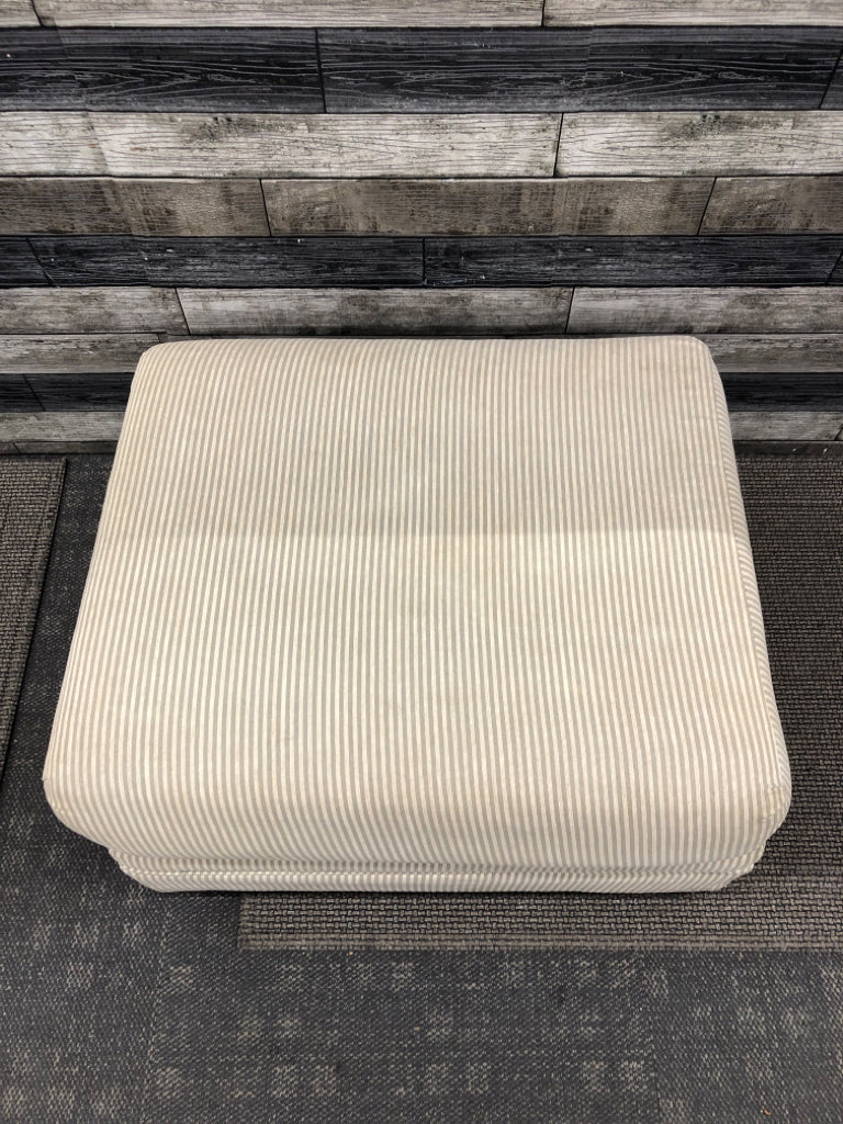 TAN/GREY STRIPED OTTOMAN.
