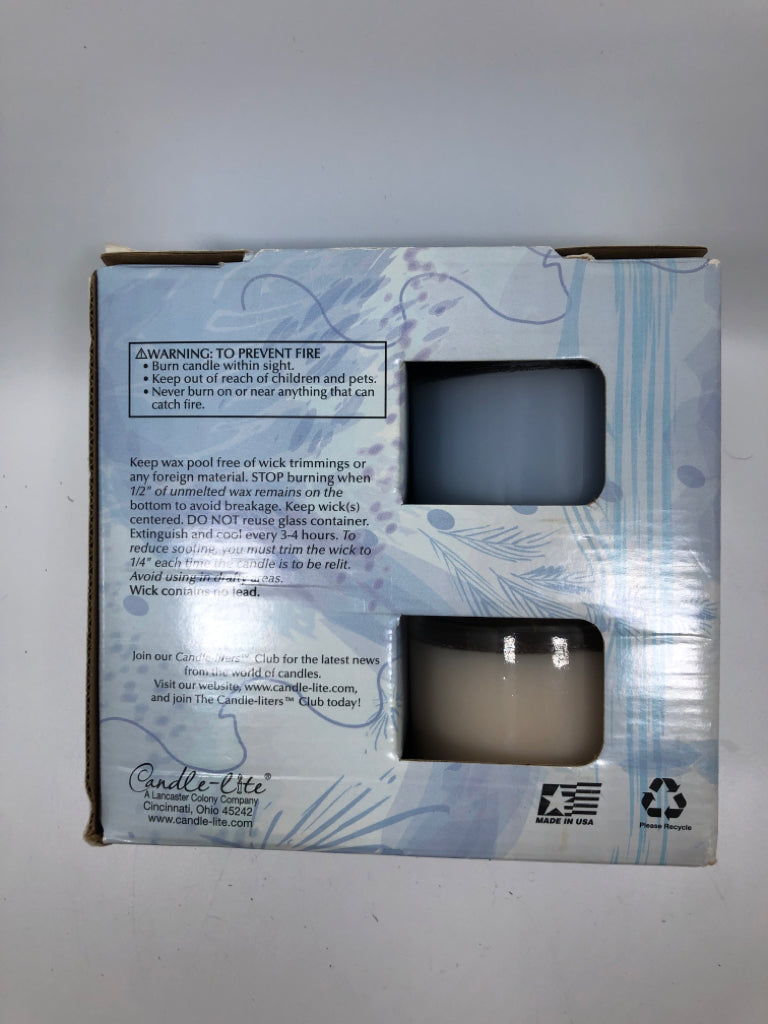 NIB 4PC CANDLE SET.