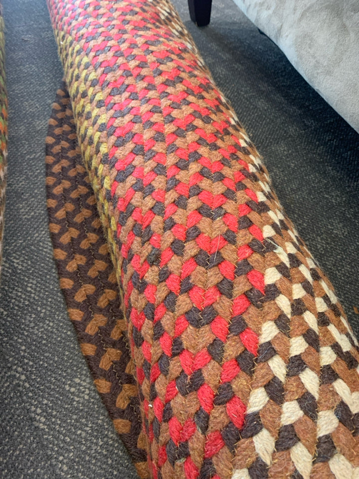 BROWN MULTI OVAL BRAIDED RUG.