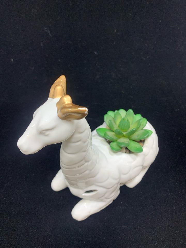 FAUX SUCCULENT IN WHITE CERAMIC GIRAFFE.