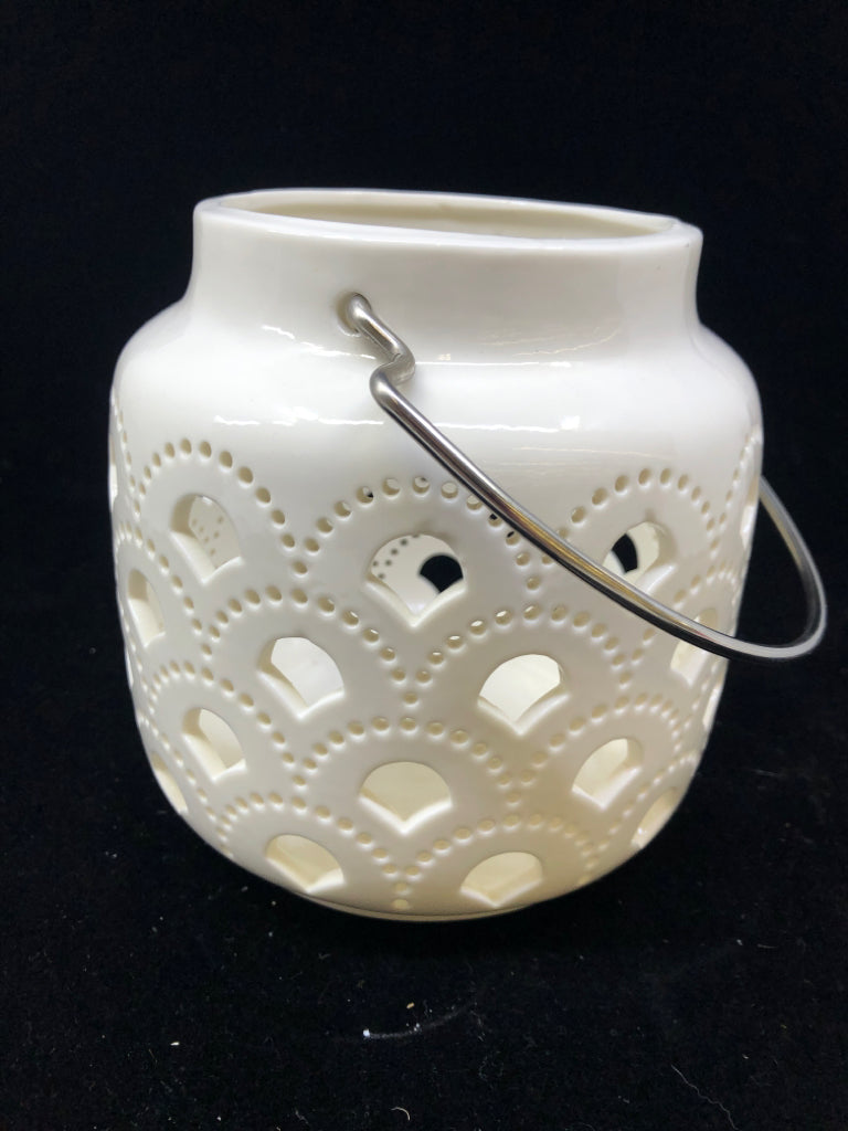 WHITE W/CUTOUTS CERAMIC CANDLE LANTERN.