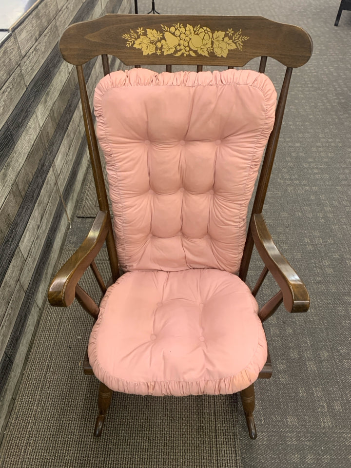 MEDIUM WOOD ROCKING CHAIR WITH GOLD FLOWER DESIGN.