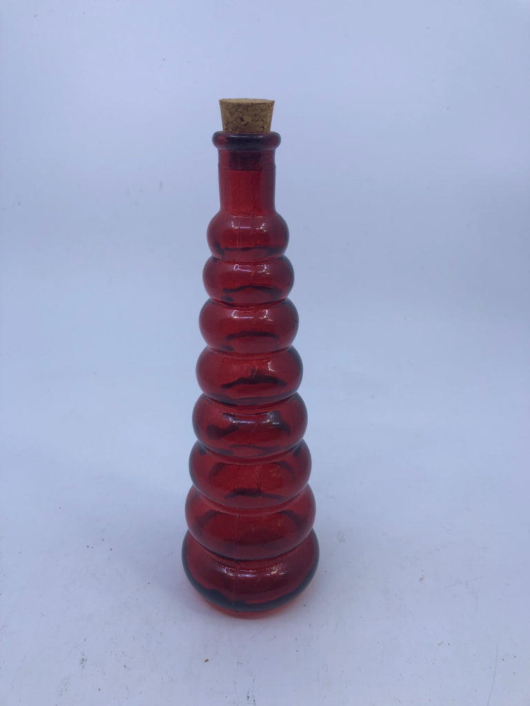 RED GLASS RIBBED BOTTLE W/CORK.