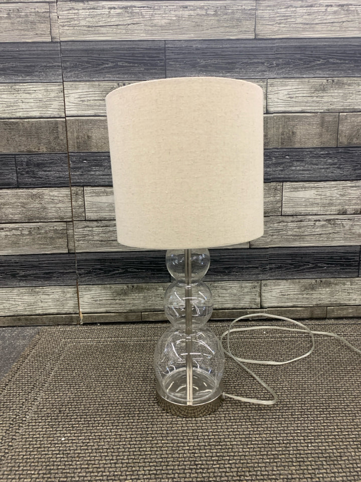 GLASS BUBBLE BASE LAMP W/ CANVAS SHADE.