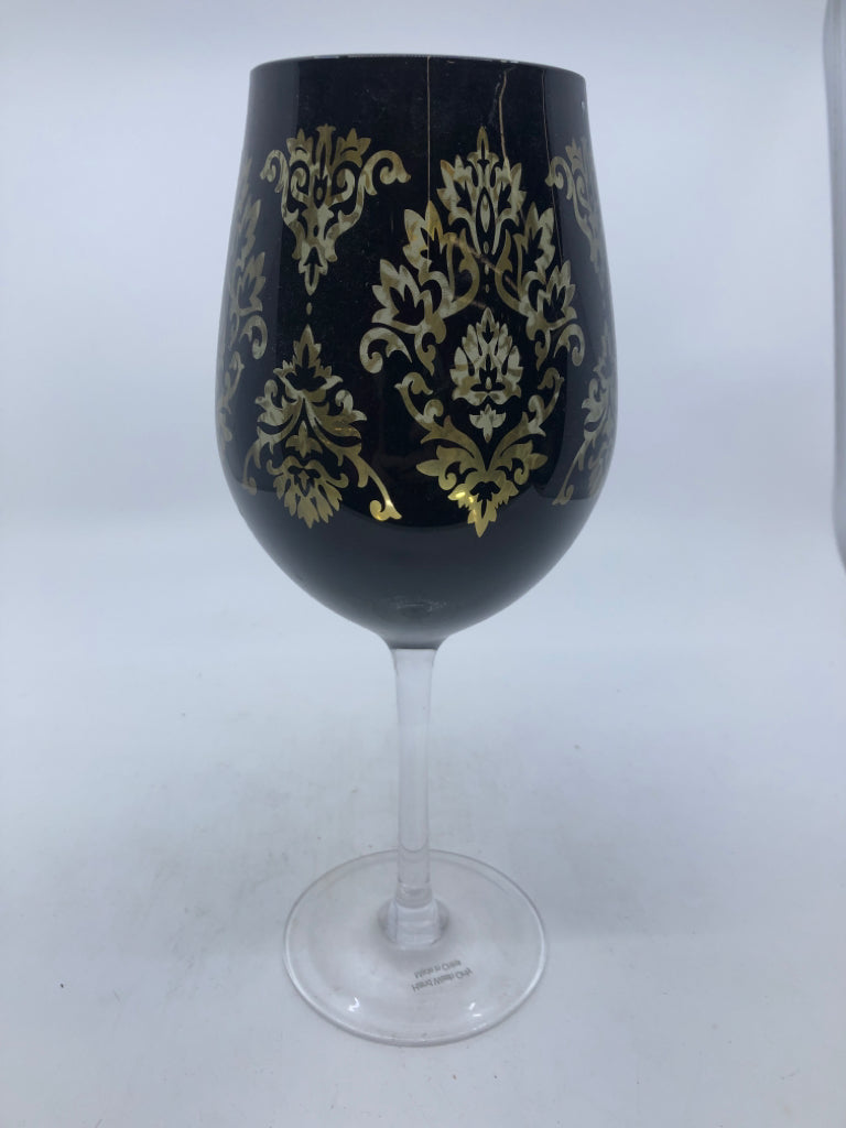 LARGE BLACK AND GOLD WINE GLASS.