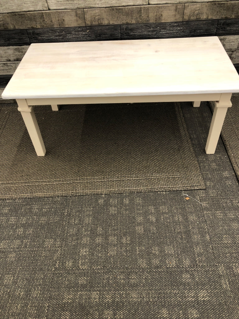 DISTRESSED WHITE TOP CREAM LEGS COFFEE TABLE.