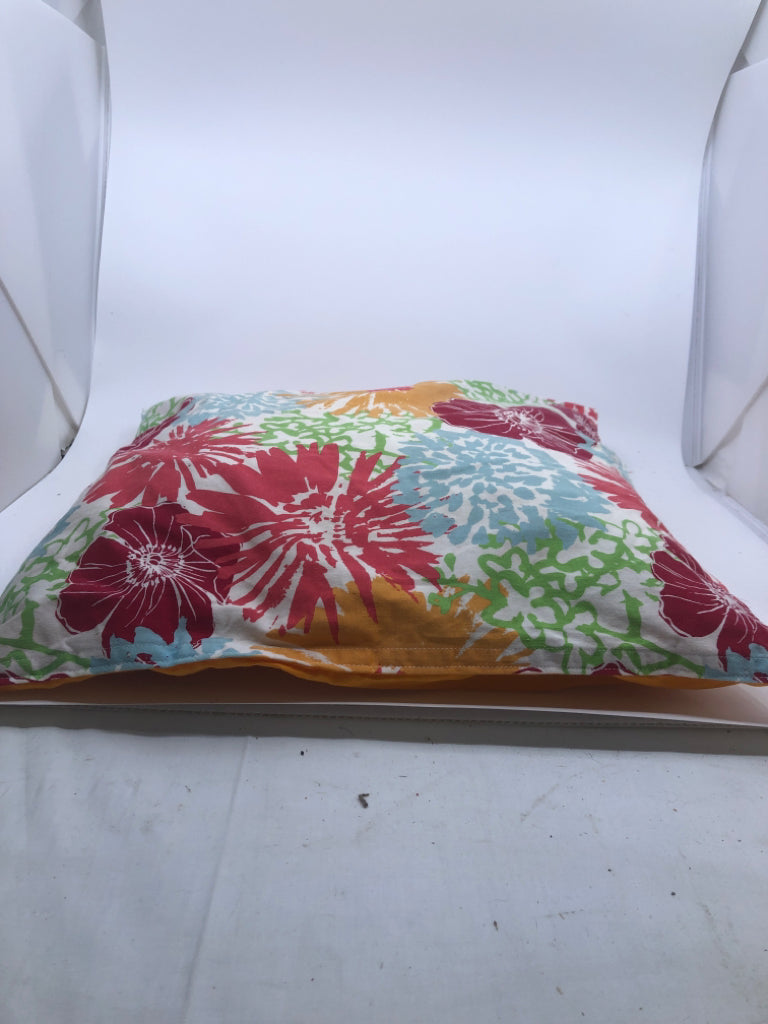COLORFUL FLOWER W/ SOLID ORANGE BACK PILLOWS.