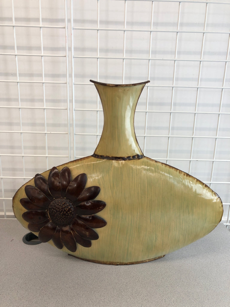 TAN METAL FLAT VASE W/BROWN FLOWER.