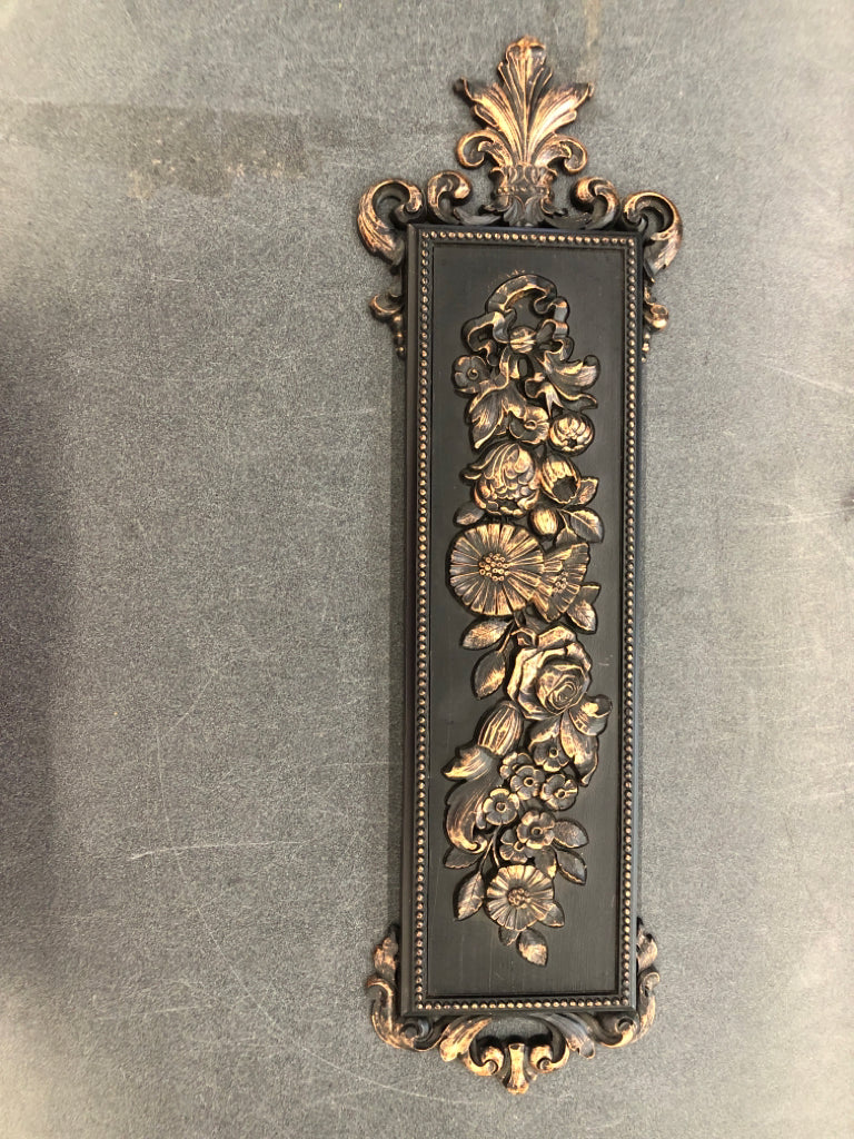 VTG BLACK W BRONZE FLORAL WALL HANGING.