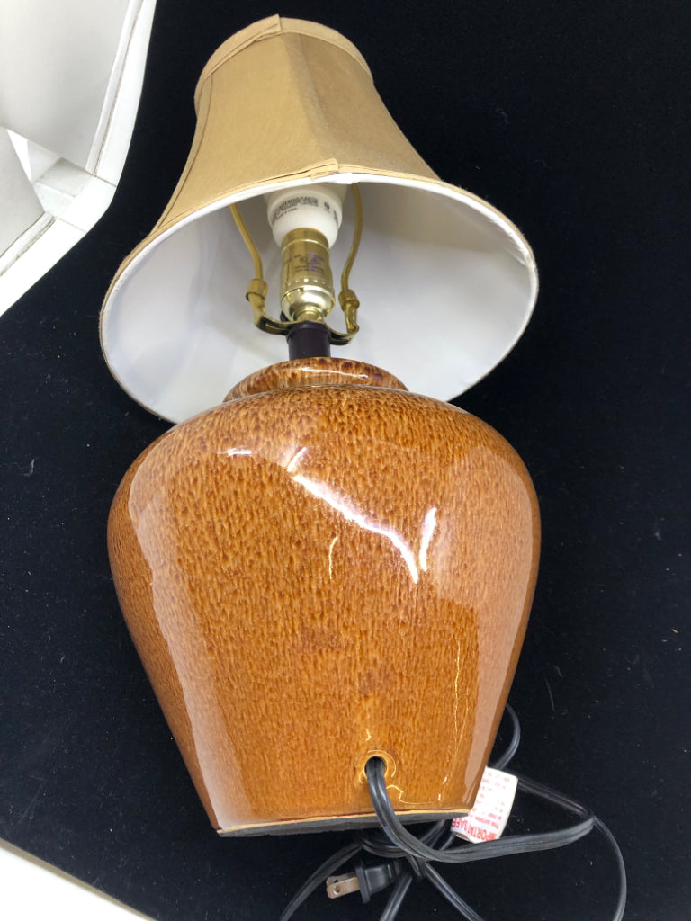 BROWN POTTERY BASE LAMP W TAN SHADE.
