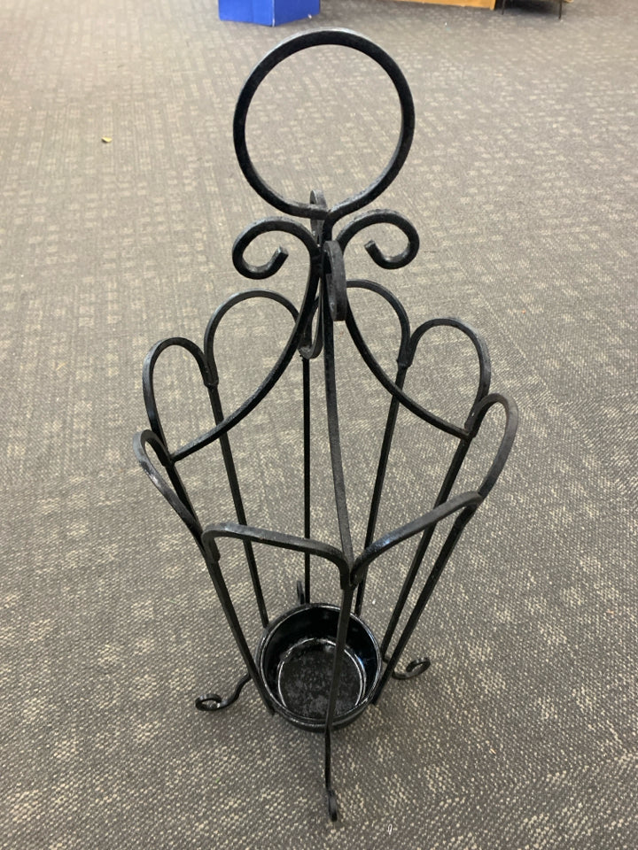 METAL UMBRELLA HOLDER.