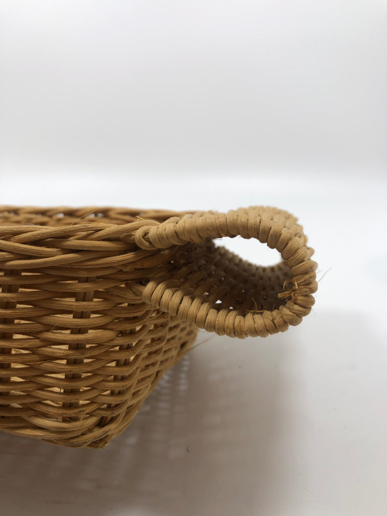 RECTANGULAR WICKER BASKET W FOLDED HANDLES.