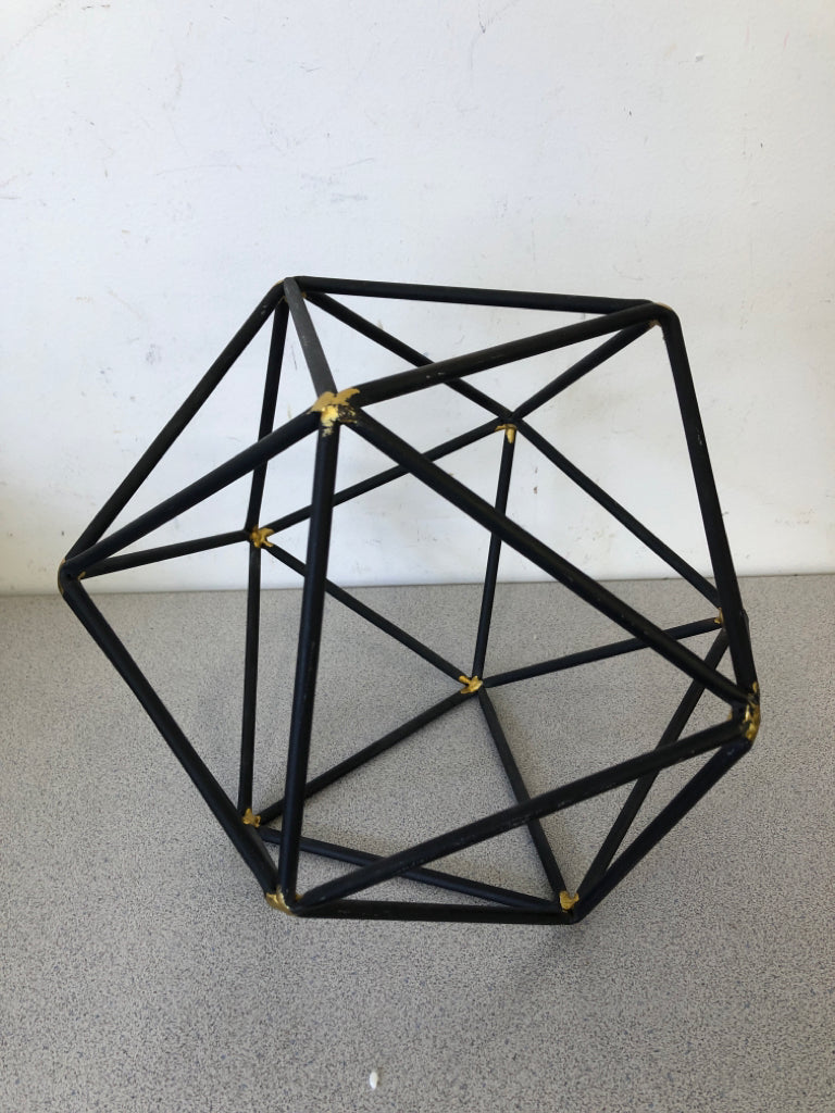 BLACK HEXAGON DECOR W/GOLD POINTS.