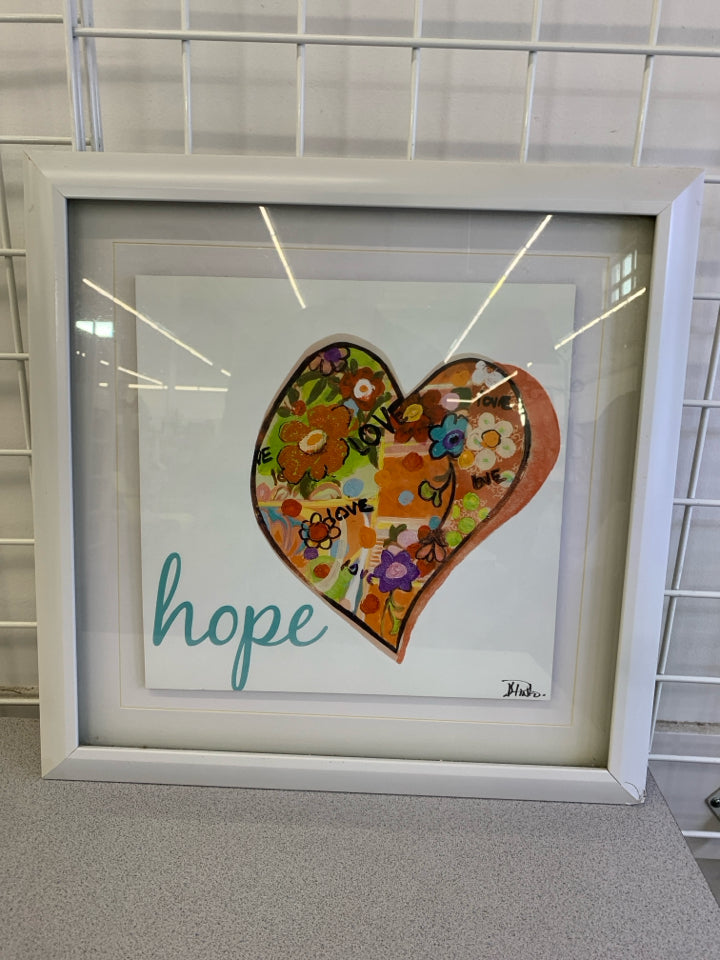 HEARTS OF HOPE FRAMED IN WHITE.