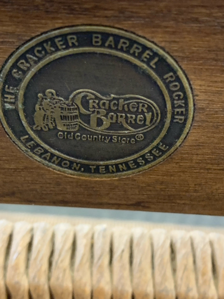 CRACKER BARREL WOVEN SEAT ROCKING CHAIR.