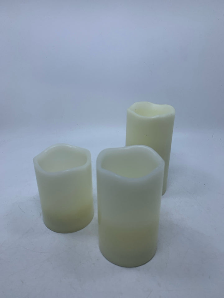 3 FAUX BATTERY POWERED CANDLES.
