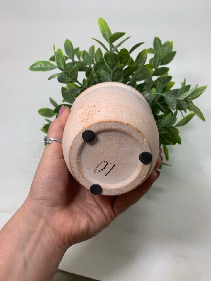 TERRA COTTA PLANTER W/ FAUX LEAVES.