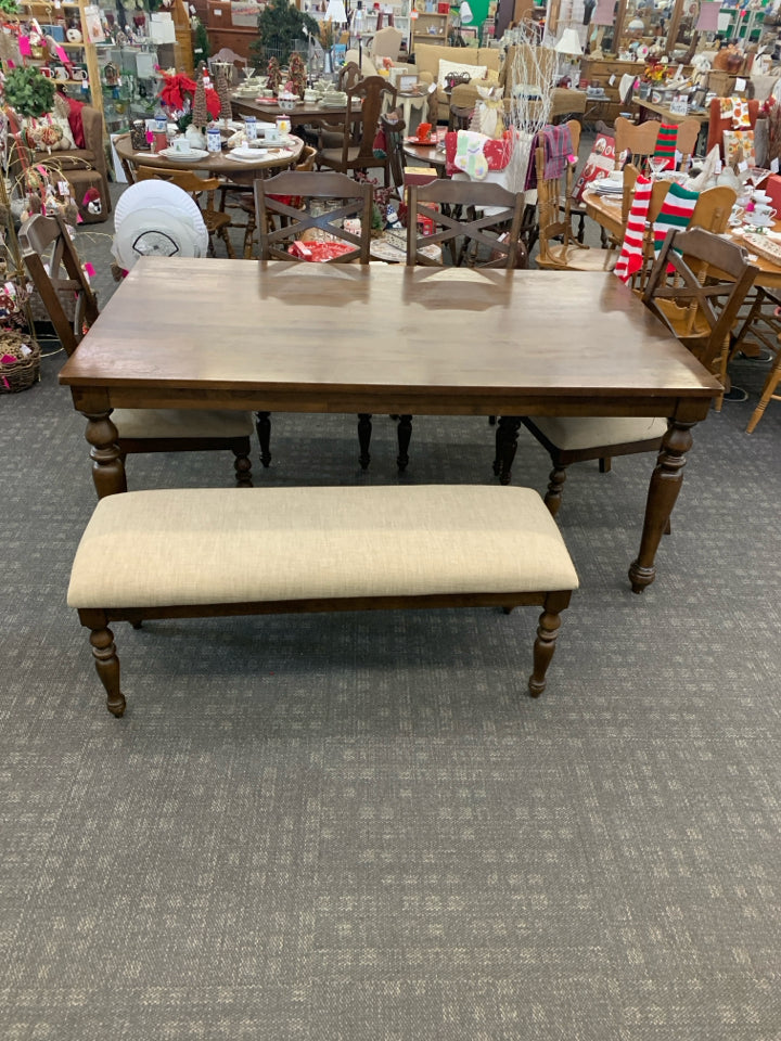 DARK WOOD TABLE W 4 CREAM CUSHIONED CHAIRS AND BENCH.