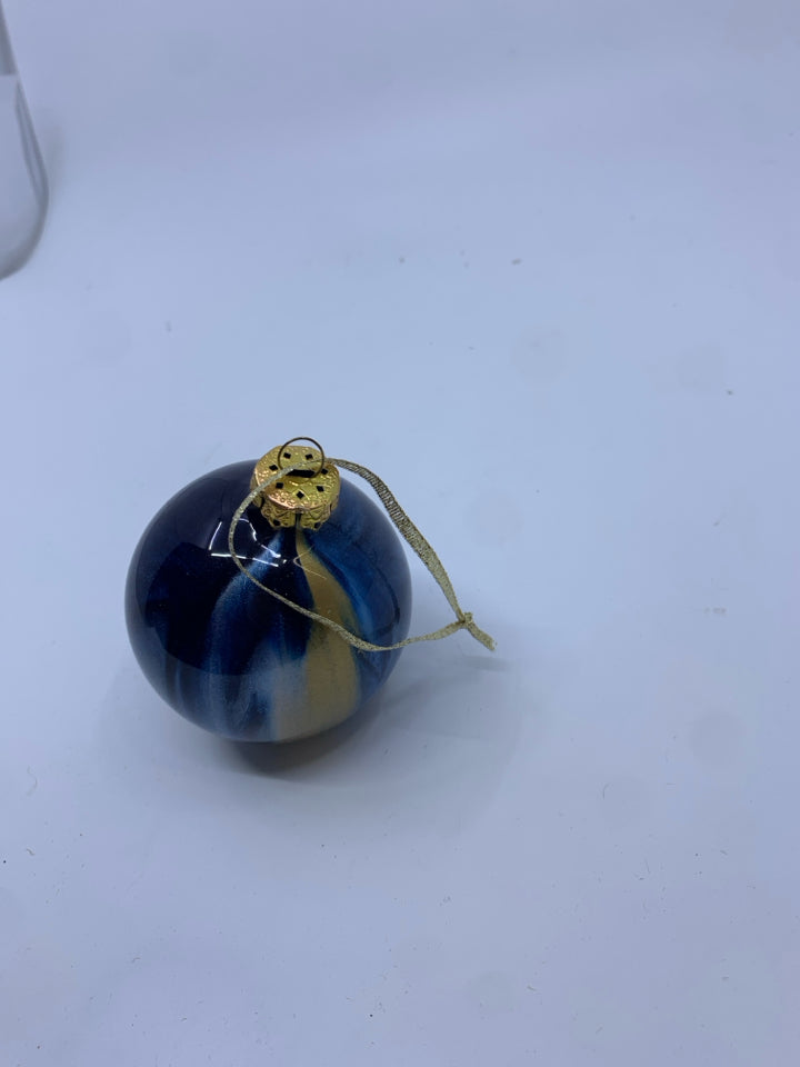 BLUE AND GOLD STRIPED BULB ORNAMENT.