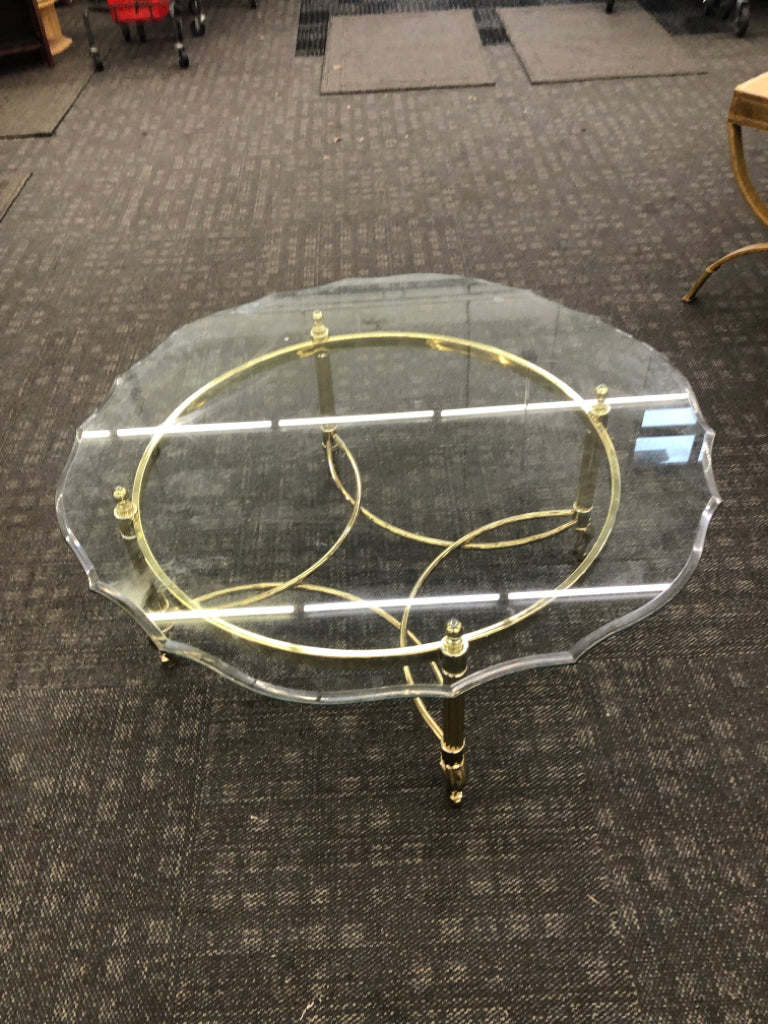 GOLD LEGGED CIRCLE COFFEE TABLE W/GLASS TOP.