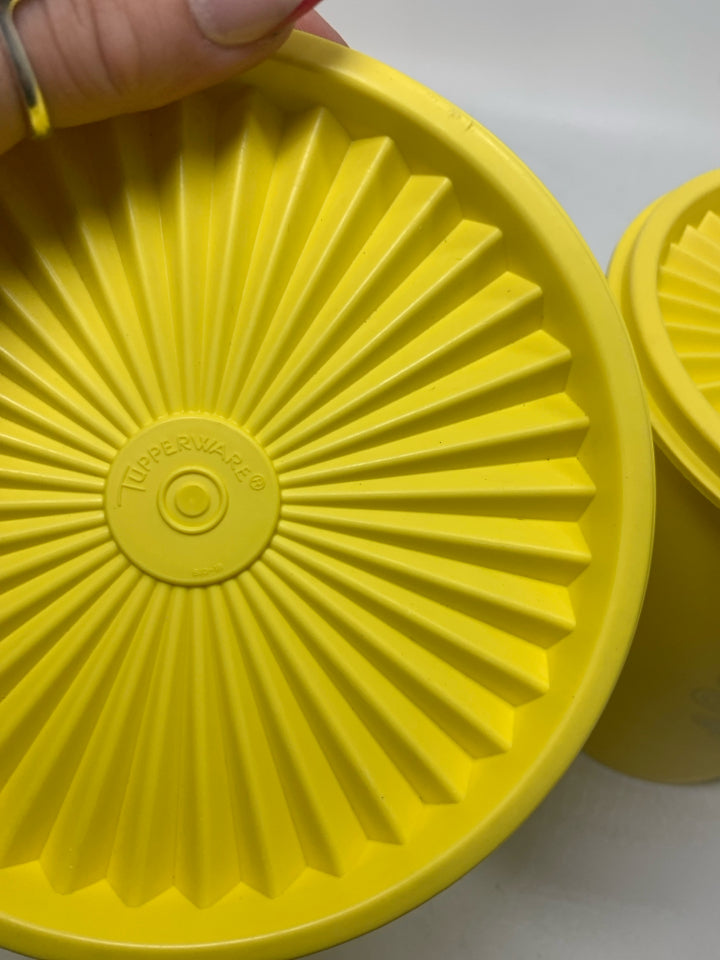 2 VTG NESTING YELLOW SERVALIER CANISTERS.