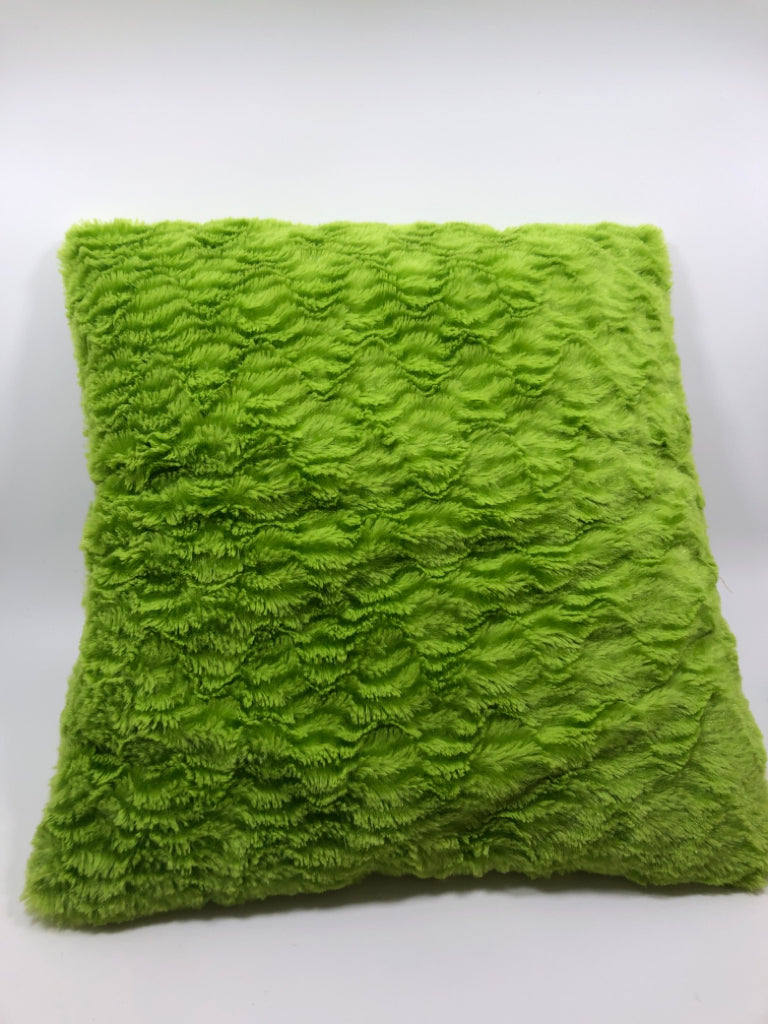 GREEN FUZZY THROW PILLOW.
