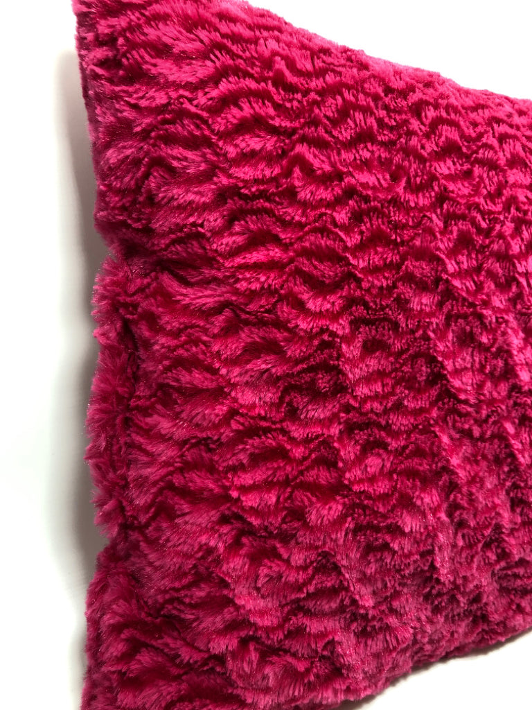 FUZZY PINK THROW PILLOW.