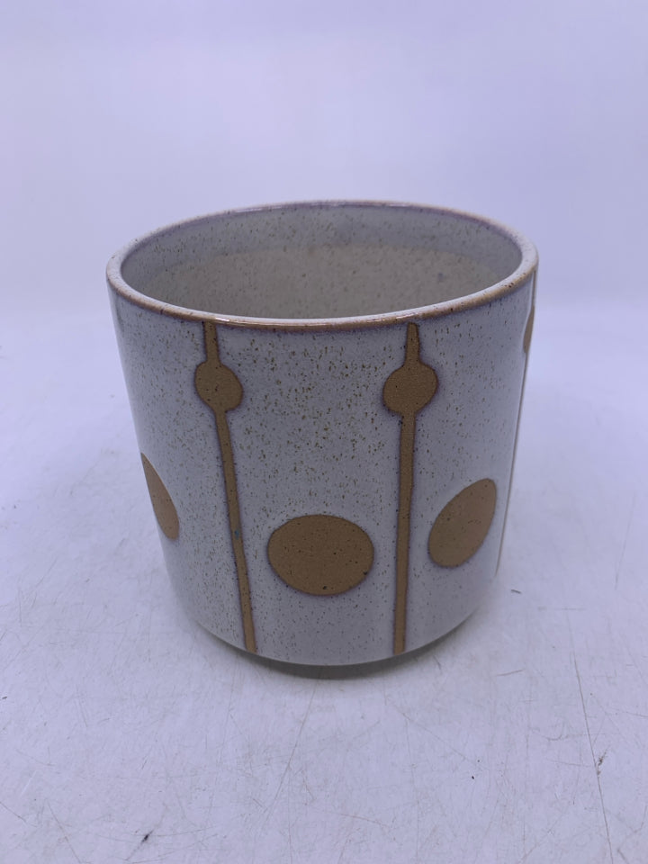 TAN W/ WHITE GLASS CIRCLE DESIGNS.