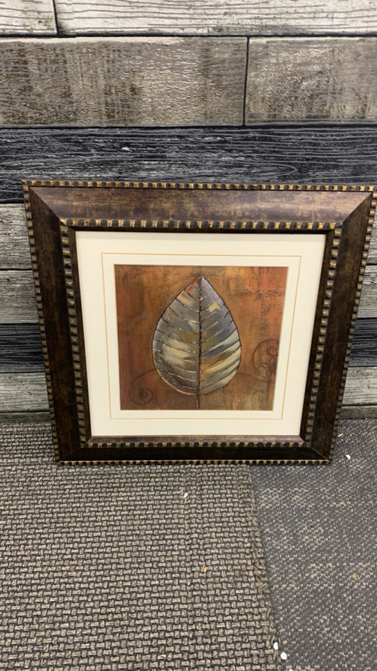 RUSTIC LEAF IN BROWN FRAME W/SQUARE DESIGN.