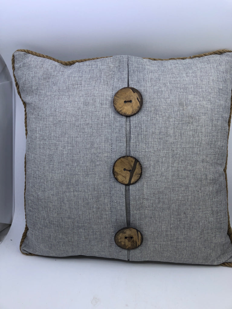 LIGHT GREY SQUARE PILLOW W/ LARGE BUTTONS/ROPE TRIM.